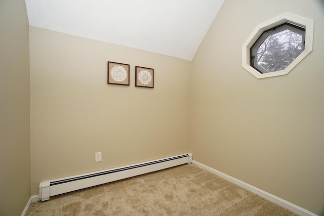 laundry room with a baseboard heating unit and light colored carpet