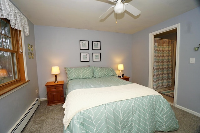 carpeted bedroom with baseboard heating and ceiling fan