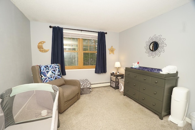 sitting room with baseboard heating and light carpet