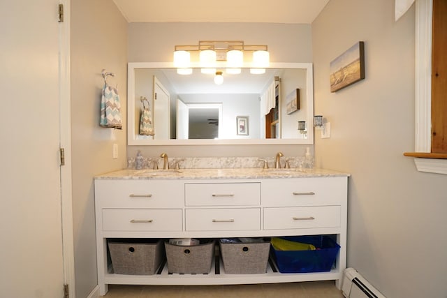 bathroom featuring vanity, tile patterned floors, and baseboard heating