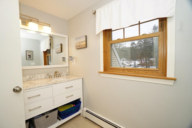 bathroom with tile patterned floors, vanity, and a baseboard heating unit