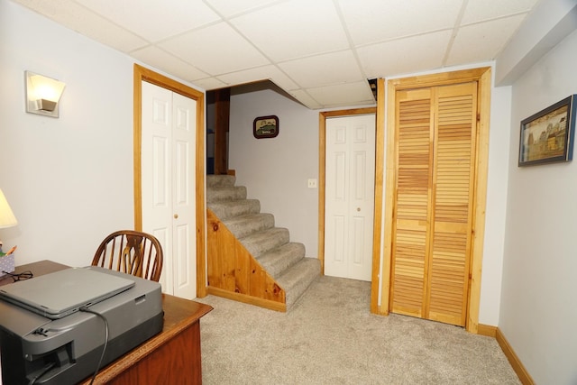 office featuring light colored carpet and a drop ceiling