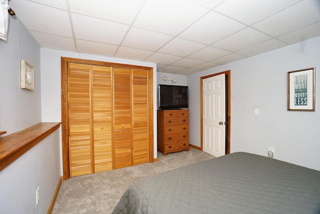 carpeted bedroom featuring a closet