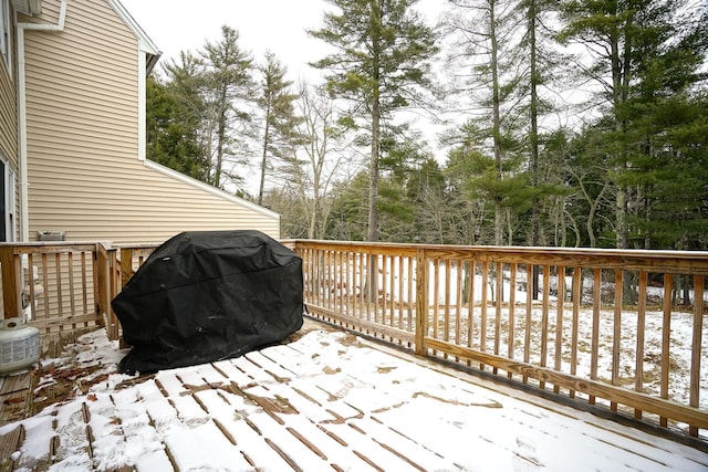 snow covered deck with area for grilling