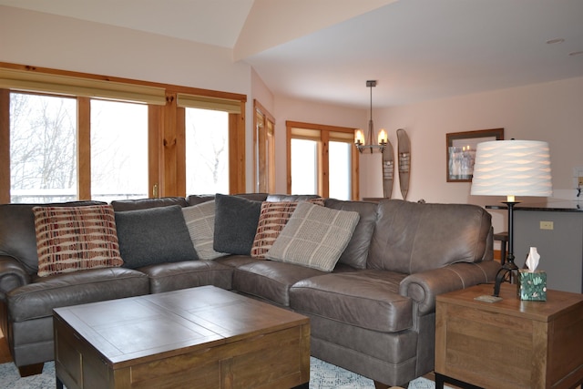 living room with an inviting chandelier and a healthy amount of sunlight