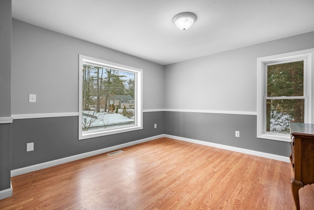 spare room featuring light hardwood / wood-style floors