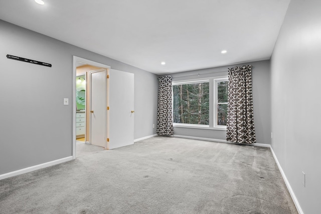 spare room with light colored carpet