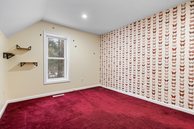 additional living space with lofted ceiling and carpet floors