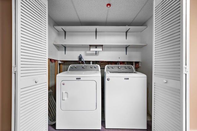 clothes washing area with independent washer and dryer