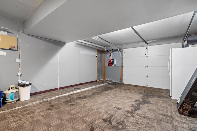 garage with white fridge