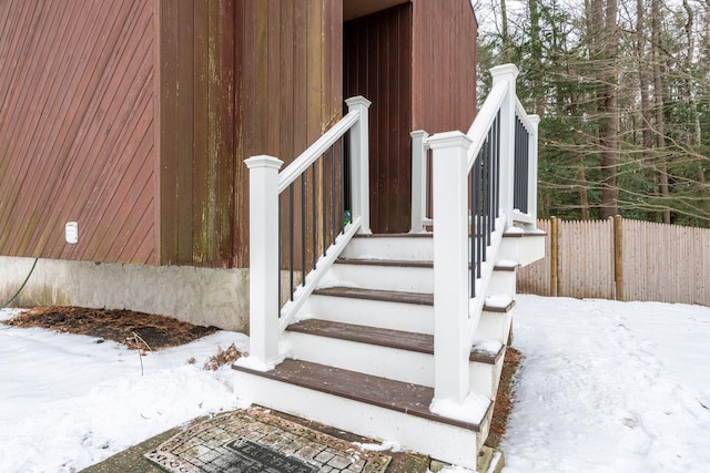 view of snow covered property entrance