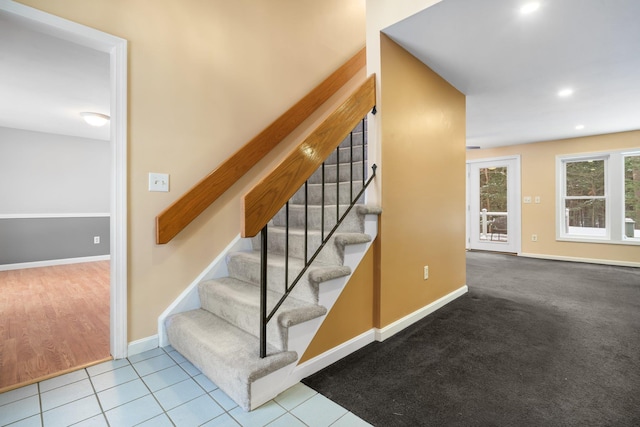 staircase with tile patterned flooring