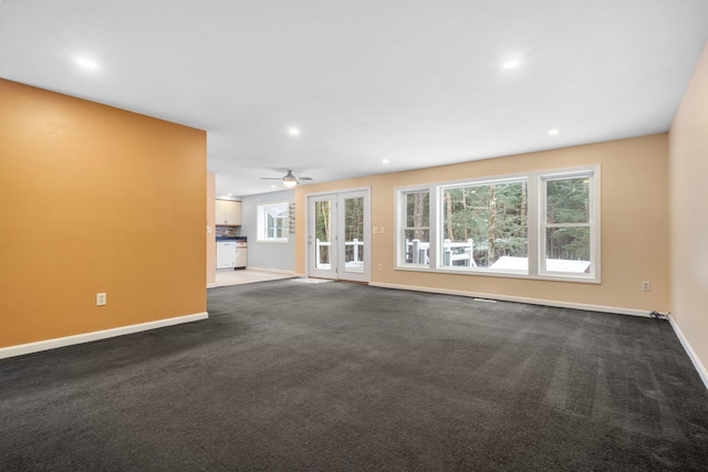 unfurnished living room featuring carpet flooring and ceiling fan