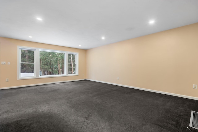 empty room with dark carpet