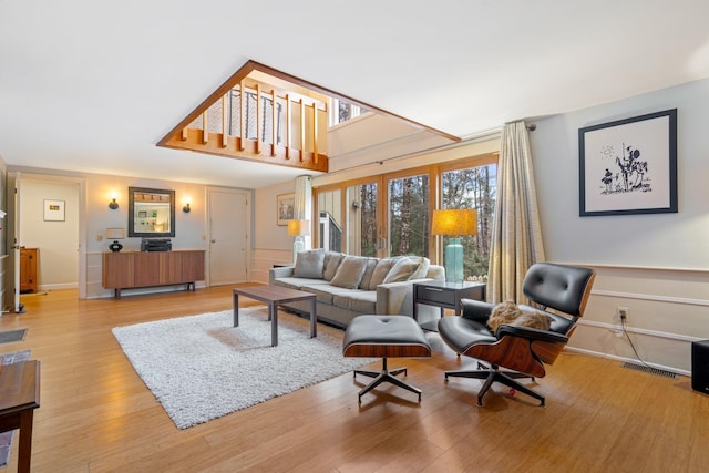 living room with light hardwood / wood-style flooring