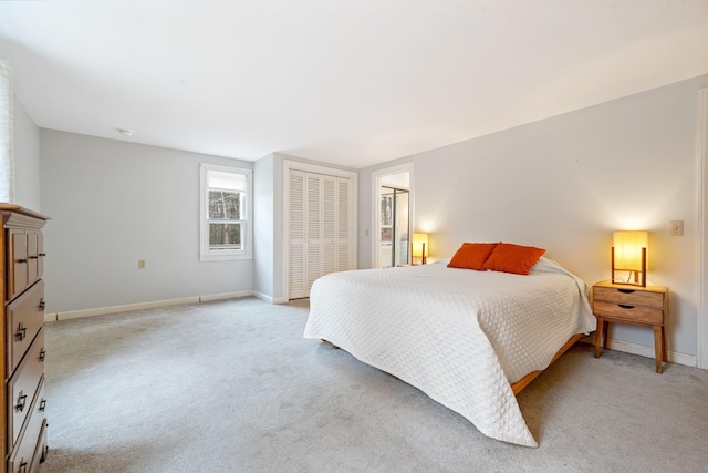 carpeted bedroom with a closet