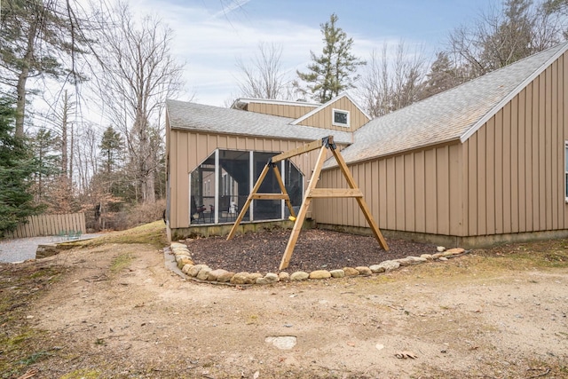 view of outbuilding featuring a sunroom