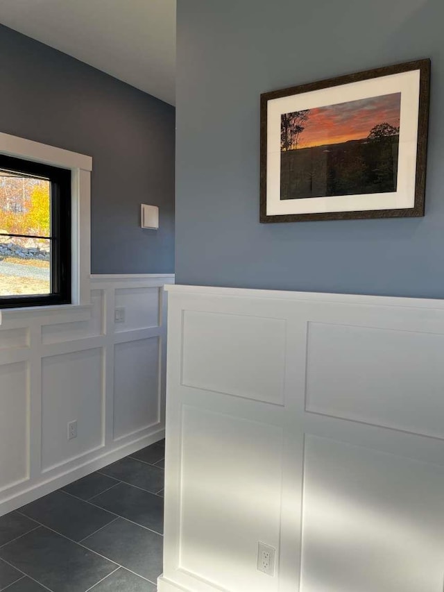 interior space with dark tile patterned floors