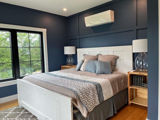 bedroom with hardwood / wood-style flooring