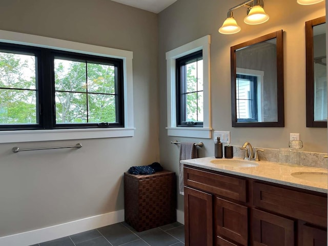 bathroom featuring tile patterned flooring and vanity