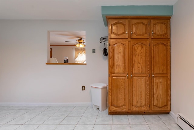 bathroom with a baseboard radiator, tile patterned flooring, and ceiling fan