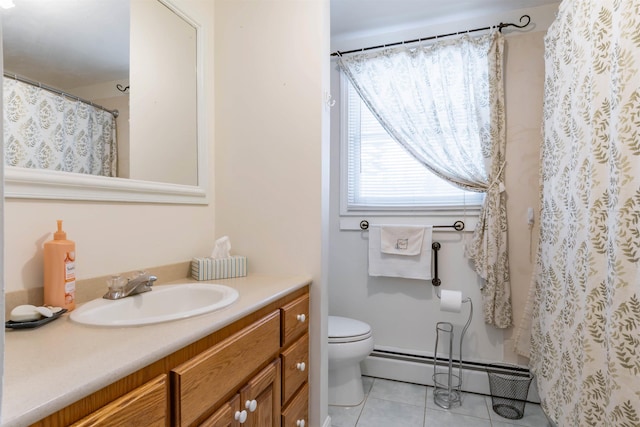 bathroom with vanity, toilet, tile patterned floors, and a baseboard heating unit