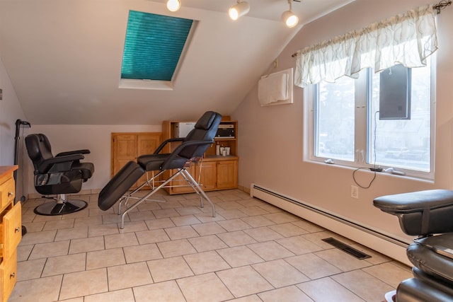 workout room featuring baseboard heating, vaulted ceiling, and light tile patterned floors