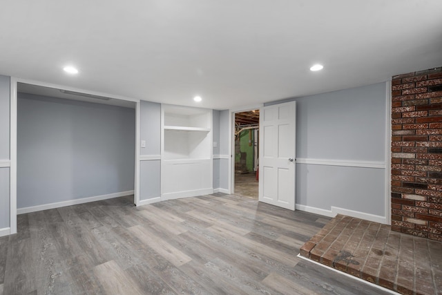 basement featuring hardwood / wood-style floors