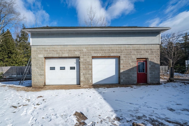 view of snow covered garage