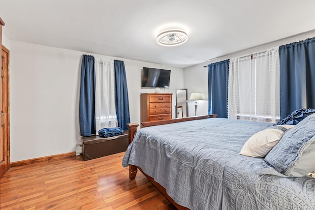 bedroom with wood-type flooring