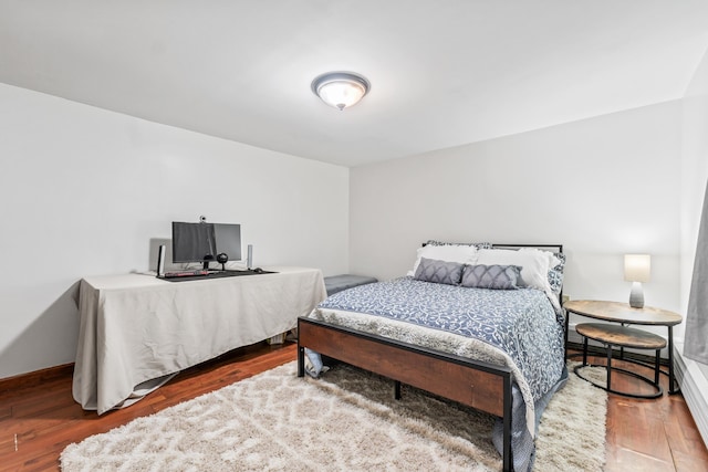 bedroom with wood-type flooring