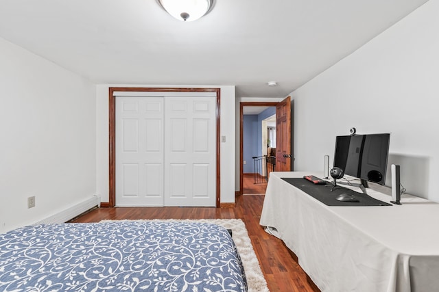 bedroom with hardwood / wood-style flooring and a closet