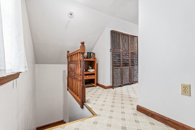 wine room featuring lofted ceiling