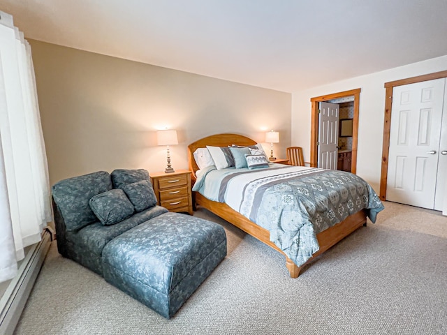 carpeted bedroom with baseboard heating