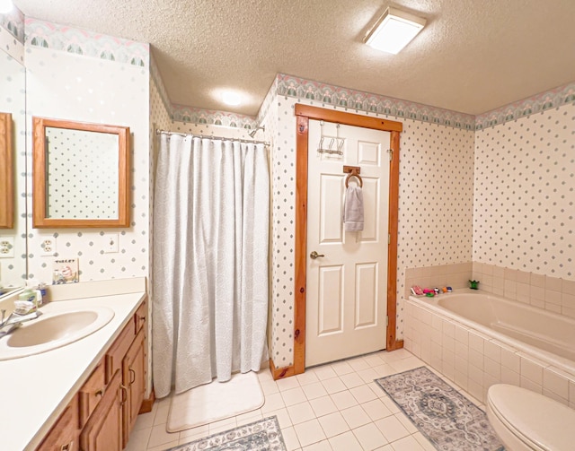 full bathroom with a textured ceiling, separate shower and tub, tile patterned floors, and vanity