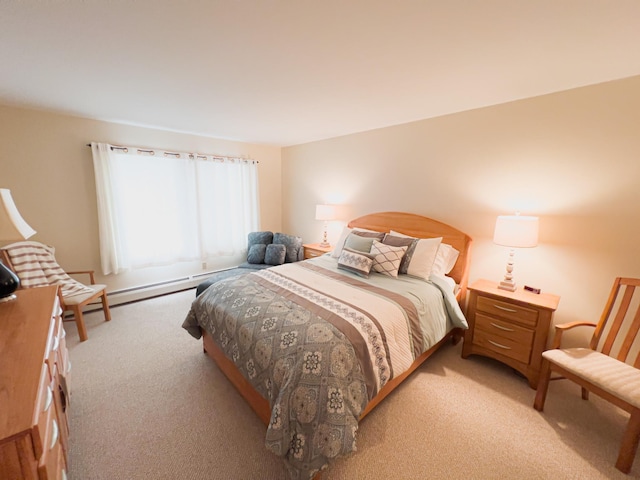 carpeted bedroom featuring a baseboard heating unit