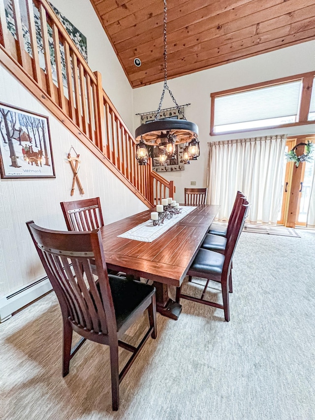 dining room with light carpet, lofted ceiling, an inviting chandelier, a baseboard radiator, and wooden ceiling