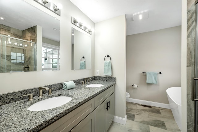 full bathroom with separate shower and tub, vanity, and toilet