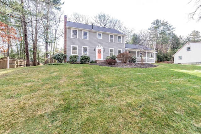 colonial-style house with a front yard