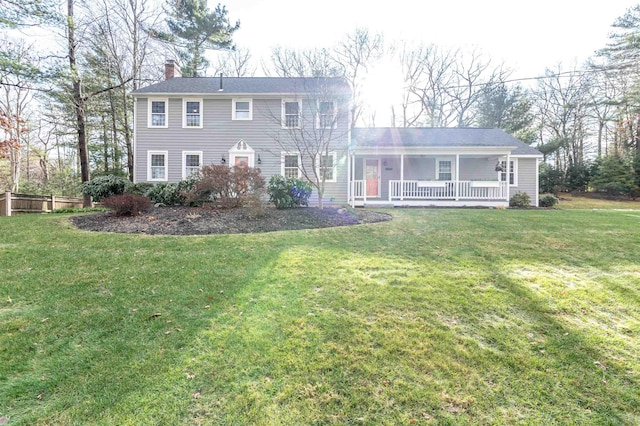 colonial-style house with a porch and a front lawn