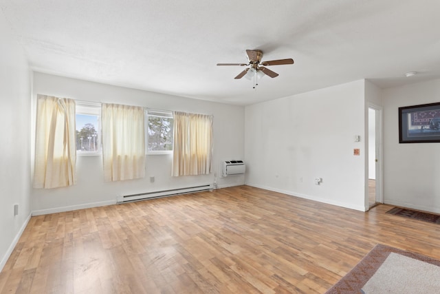 unfurnished room featuring a baseboard heating unit, light wood-type flooring, ceiling fan, and a wall mounted AC