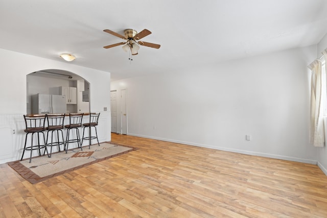 unfurnished room featuring ceiling fan and light wood-type flooring