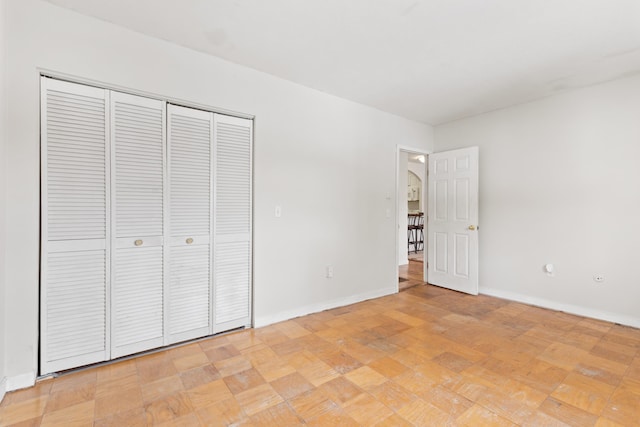 unfurnished bedroom featuring a closet