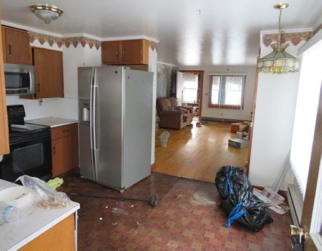 kitchen with a notable chandelier and stainless steel appliances