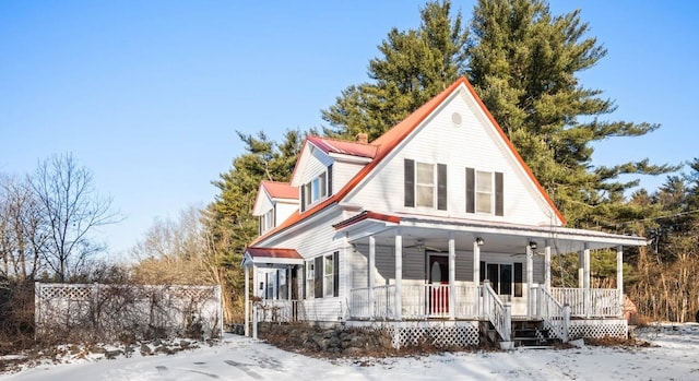 country-style home featuring covered porch