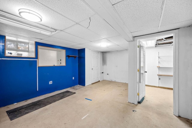 basement featuring a drop ceiling