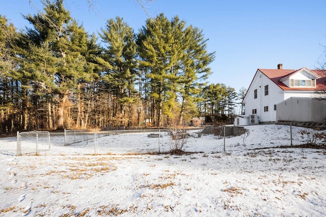 view of yard covered in snow