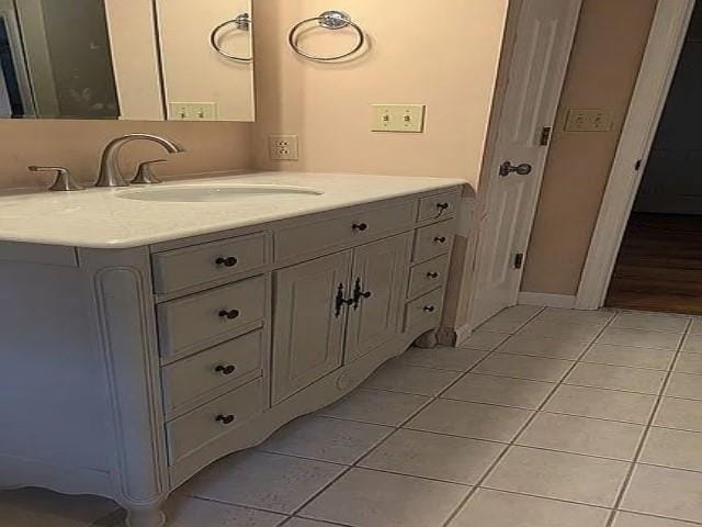 bathroom with tile patterned flooring and vanity