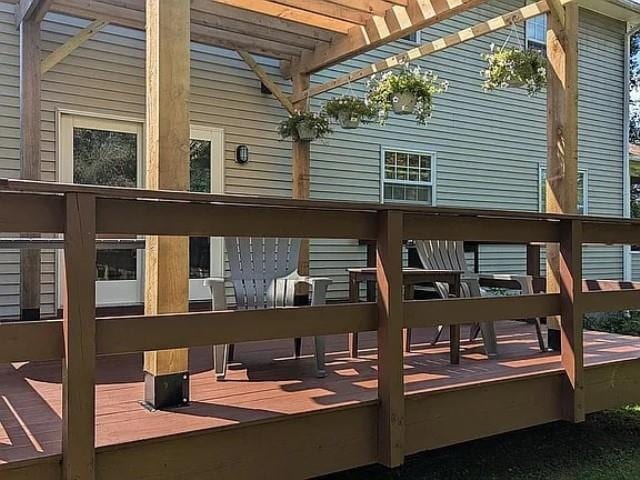 exterior space with a deck and a pergola