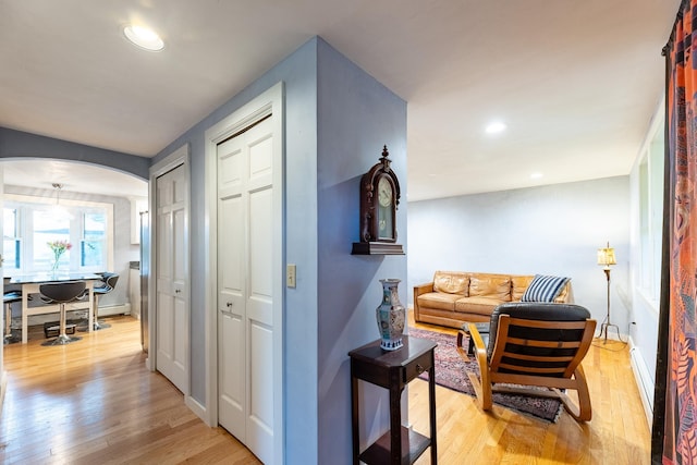 hallway with light hardwood / wood-style flooring